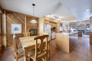 Pull up a chair. The dining table at Park Avenue 224 seats the whole group comfortably — a warm, welcoming spot for shared meals during your Park City vacation rental stay.