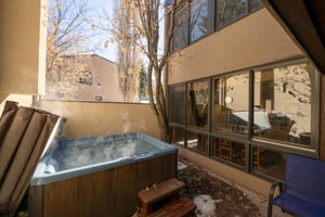 One of the most popular features at Park Avenue 224 — a private outdoor hot tub tucked into a quiet courtyard, ready to make every evening at this Park City vacation rental memorable.