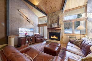 Vaulted wood ceilings, a soaring stone fireplace, and rich leather furnishings — Park Avenue 227 is mountain luxury at its finest.