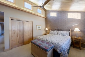 Vaulted wood ceilings, clerestory windows, and a serene atmosphere — every bedroom at Park Avenue 227 is a true mountain retreat.