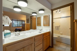 Double sinks, a spacious shower, and warm wood finishes — the bathrooms at Park Avenue 231 are designed with your comfort in mind.
