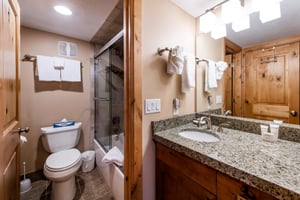 Granite counters, a glassenclosed shower, and warm knotty pine accents — the bathrooms at Park Avenue 236 deliver comfort and style in equal measure.
