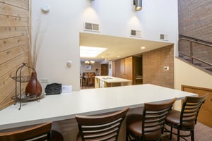 Gather around the expansive kitchen bar at Park Avenue 243 — where openconcept living and modern comforts come together for the ultimate Park City condo rental experience.