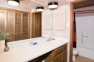 The clean and spacious bathroom at Park Avenue 243 features an oversized vanity and ample storage, providing all the everyday comforts expected from quality Park City vacation rentals.