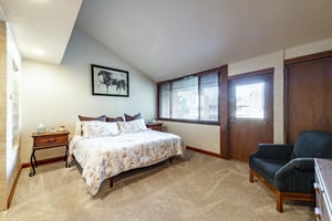 Unwind in the serene and spacious bedroom at Park Avenue 245, where understated mountain comfort makes this Park City vacation rental the perfect place to recharge after a day of adventure.
