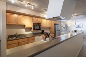 Fully stocked and ready for anything — the bright and functional kitchen at Park Avenue 251 makes group cooking a breeze, adding a personal touch to your Park City lodging experience.