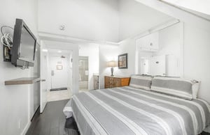 Natural light create a peaceful master bedroom escape at Lodge at Mountain Village 303, skiinskiout at Park City Resort.