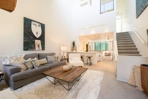 Open, airy, and effortlessly elegant — the main living area at Park Avenue 299 is designed for gathering and relaxing. With soaring ceilings and a seamless flow into the kitchen, this Park City vacati