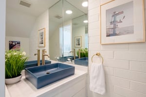 Even the details impress at Park Avenue 299. The main level half bathroom features a bold navy vessel sink, gold fixtures, and crisp white tile — a stylish touch that sets this Park City vacation rent