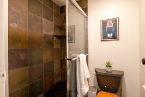 Relax and recharge in the beautifully tiled tubshower combo at Park Avenue 299. Rich slate tile and premium finishes bring a warm, spainspired feel to this Park City vacation rental.