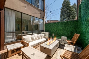 Al fresco evenings dont get better than this. The outdoor patio at Park Avenue 299 features a fire pit, plush seating, and string lights — a dreamy setting that sets this Park City vacation rental ap