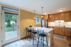 Let the sunshine in The lightfilled kitchen at Pay Day 183 features a spacious breakfast bar and easy access to the outdoors. Everything youd want in a Park City vacation rental, and then some.