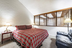 Full of character and mountain charm, the king bedroom at Park Avenue 333 offers a uniquely cozy sleeping experience. Exposed brick, sloped ceilings, and classic décor make this Park City vacation ren