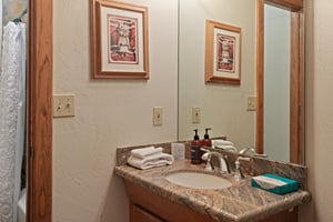 Thoughtfully appointed with granite countertops and fresh linens, this charming bathroom at 1296 Pinnacle reflects the attention to detail that makes this Park City vacation rental a guest favorite.