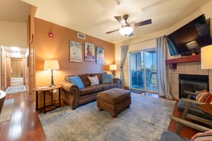 The lightfilled living room at Bear Hollow 4402 opens to a private balcony, bringing the beauty of Park City right to your door. Ideal Park City lodging for those who love comfort and convenience.