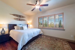 Rest easy in the primary bedroom at Bear Hollow 4402, featuring a plush kingsize bed and serene mountain views. This Park City vacation rental offers the comfort and relaxation you deserve after a da