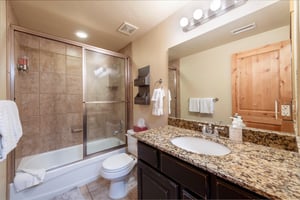 Clean and fully equipped, the shared bathroom at Bear Hollow 4402 includes a tubshower combo and granite countertops. Another thoughtful detail that makes this Park City lodging ideal for families an