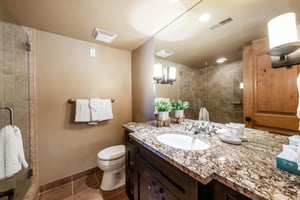 Fresh and stylish, the bathroom at Jupiter Inn 17 includes granite countertops and a walkin shower. A polished finishing touch that makes this Park City condo rental studio a cut above the rest.