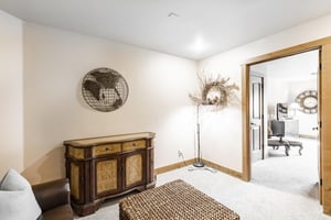 The cozy secondary living area at Jupiter Inn 18 creates a natural transition between the main living space and bedroom, offering a little extra room to spread out in this Park City condo rental.