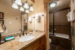 No detail was overlooked at Resort Plaza 5002 — this wellfinished bathroom with granite vanity and elegant fixtures makes this Park City condo rental a cut above the rest for a truly comfortable moun