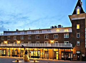 The warm evening glow of Resort Plaza 5022 welcomes you home after a day on the slopes — a stunning and centrally located Park City condo rental for your Park City lodging getaway.