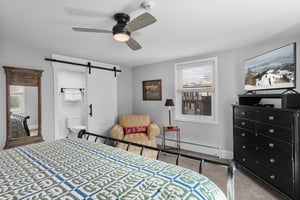 This inviting bedroom blends modern comfort with cozy mountain character, complete with a relaxing sitting area and great natural light. Look no further for the perfect Park City condo rental.