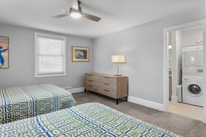 Clean, calm, and thoughtfully furnished, this relaxing bedroom features warm wood accents and plenty of space to unwind. Every detail is designed for a comfortable Park City vacation rental experience