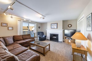 Settle into this warm and welcoming living room, complete with a cozy fireplace and plenty of comfortable seating for the whole group. The perfect home away from home for your Park City vacation renta