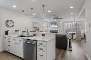 Step into an open, elegantly designed space where the kitchen flows seamlessly into your living and dining areas, perfect for gathering and relaxation.
