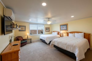Rest and recharge in the spacious double queen bedroom at Resort Plaza 5052, offering plush bedding and plenty of room for the whole group to sleep comfortably in this premier Park City vacation renta