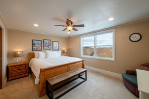Retire to the elegant king bedroom at Resort Plaza 5052, where the beautiful wooden bed frame, sweeping mountain views, and serene atmosphere combine to make this Park City condo rental the ultimate s