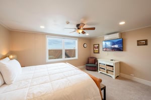 Wake up to breathtaking mountain views from the comfort of your king bedroom at Resort Plaza 5052, a Park City lodging that perfectly balances relaxation and style with modern amenities like a wallmo