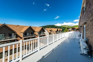 The expansive deck at Resort Plaza 5052 offers an incredible vantage point to take in Park Citys stunning natural surroundings, making this Park City vacation rental the ideal spot to relax outdoors 