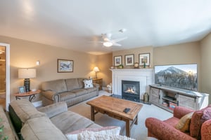 Cozy up by the fireplace and let the stresses of everyday life melt away in the warm and comfortable living room at Resort Plaza 5064, a Park City condo rental that creates the perfect ambiance for a