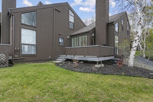 Three Kings 83s exterior reflects the classic Park City aesthetic — dark vertical siding, mature trees, and a private back deck for outdoor enjoyment.
