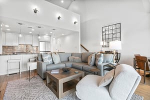 From the elegant sectional sofa to the soaring ceilings and stylish decor, the living area at Three Kings 64 sets a new standard for Park City vacation rentals, offering a sophisticated and welcoming