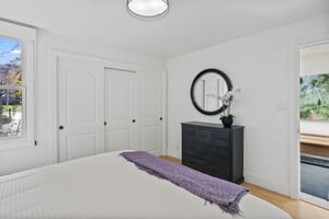 Three Kings 64 offers a bright and beautifully appointed bedroom with generous closet space, elegant dark wood furnishings, and a clean, modern aesthetic that makes this Park City vacation rental the