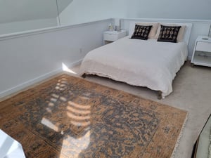 The stylish loft bedroom at Three Kings 80 offers a serene and private retreat with modern, understated elegance — a unique feature that sets this Park City vacation rental apart from the rest.