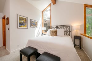 Natural light pours into the elegant loft bedroom at Three Kings 93, creating a serene and restful haven that perfectly complements the warmth and character of this beloved Park City vacation rental.