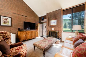 Rustic brick, vaulted ceilings, and sweeping golf course views from your Park Avenue 267 rental.