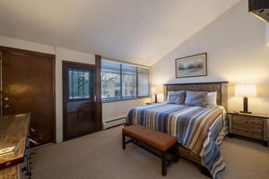 Rest and recharge in the comfortable primary bedroom at Park Avenue 268. With a cozy king bed, this Park City vacation rental offers the perfect nights sleep before another day of adventure.