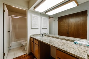 The clean and spacious bathroom with granite countertops is just one of the many thoughtful touches in Park Avenue 292.