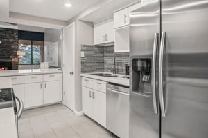 The bright and modern kitchen at Park Avenue 296 is fully stocked with stainless steel appliances and ample storage, making every meal a pleasure during your Park City stay.