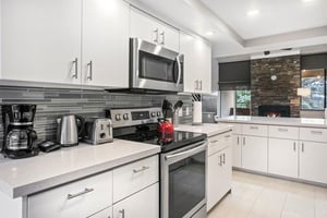 The beautifully appointed kitchen at Park Avenue 296 leaves nothing to be desired. Sleek white cabinetry, stainless steel appliances, and modern finishes make cooking a pleasure during your Park City 