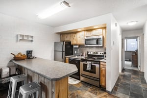 Cook up your favorite meals in the charming and fully stocked kitchen at Park Avenue 297. With stainless steel appliances and ample counter space.