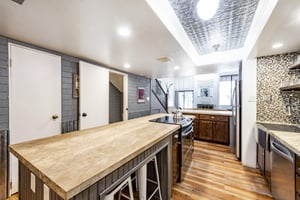 This beautifully designed kitchen with a spacious island and premium appliances makes this Park City condo rental the perfect choice for groups who love to gather.