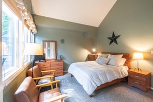 Retreat to your own private sanctuary at Pay Day 183. This beautifully styled bedroom with vaulted ceilings and warm, earthy tones is the ultimate way to end a day in the mountains.