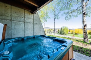 Soak in the private outdoor hot tub at Temptation 8 while taking in stunning mountain views — the perfect way to unwind after a day on the slopes.