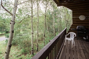 Step out onto the private deck at Temptation 8 and immerse yourself in a serene canopy of aspen trees — a peaceful and rejuvenating outdoor escape at this Park City vacation rental.