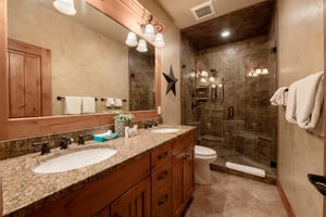 Every detail counts at Three Kings 65 — the full bathroom showcases granite countertops, a double vanity, and a generously sized walkin tile shower, making this Park City vacation rental a true home